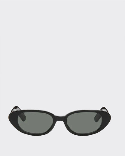 Black cat-eye sunglasses with dark lenses on a light gray background