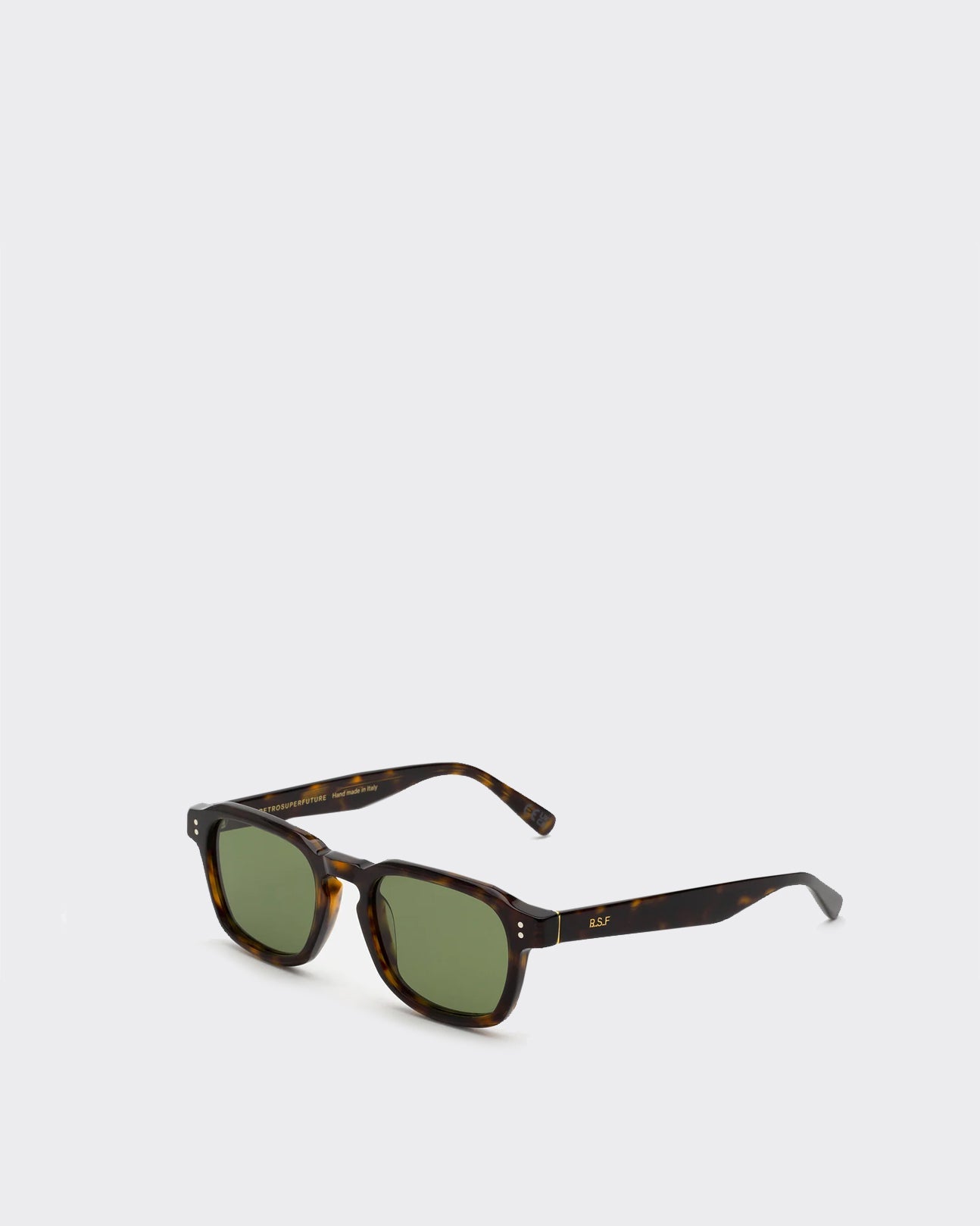 Sunglasses with tortoiseshell frame and green lenses on a white background