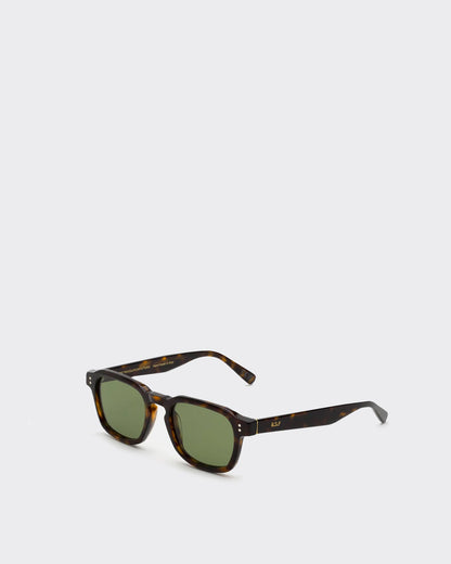 Sunglasses with tortoiseshell frame and green lenses on a white background