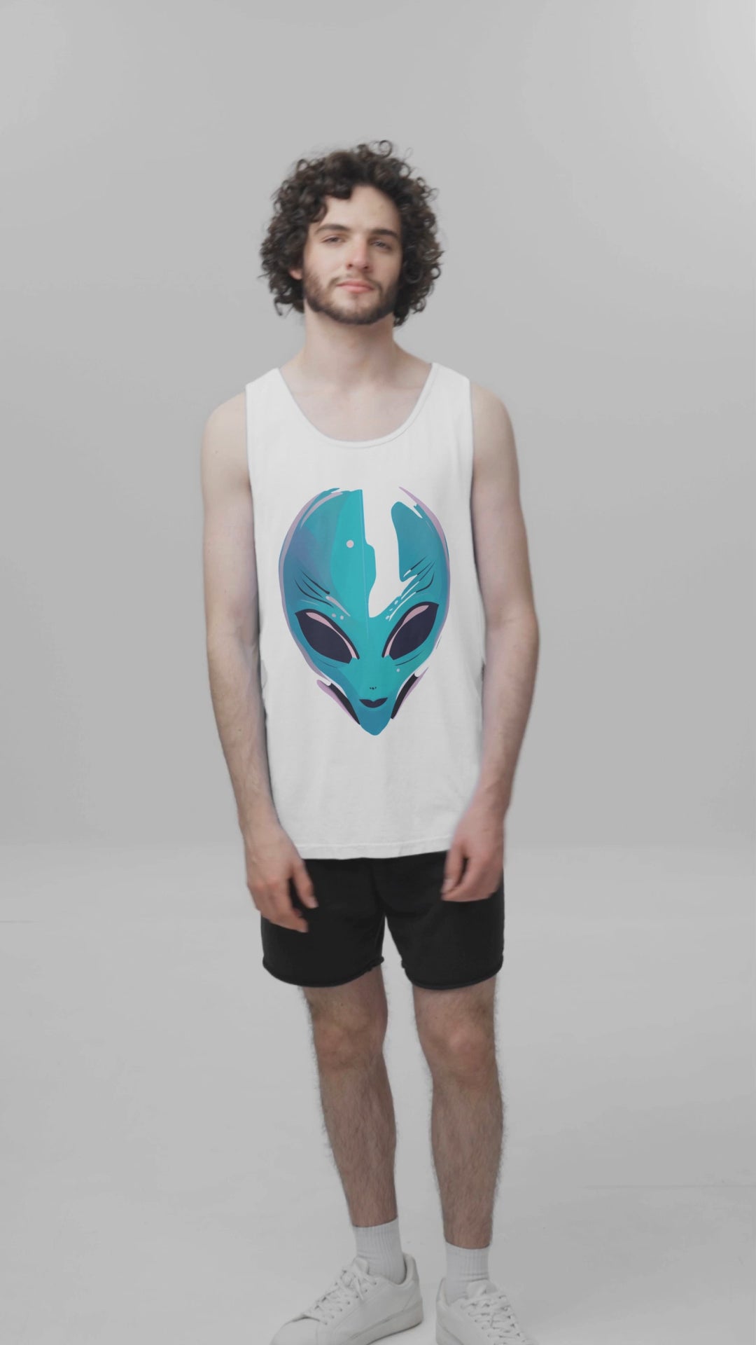 comfort-colors-tank-top-video-featuring-a-bearded-curly-haired-man-standing-in-a-studio-9056v