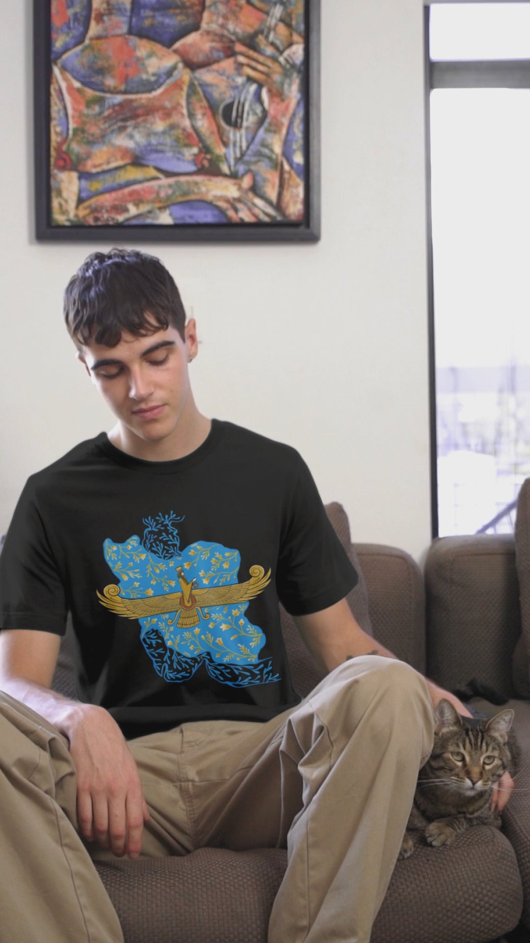 bella-canvas-tee-video-of-a-man-petting-a-cat-in-a-couch-8098v